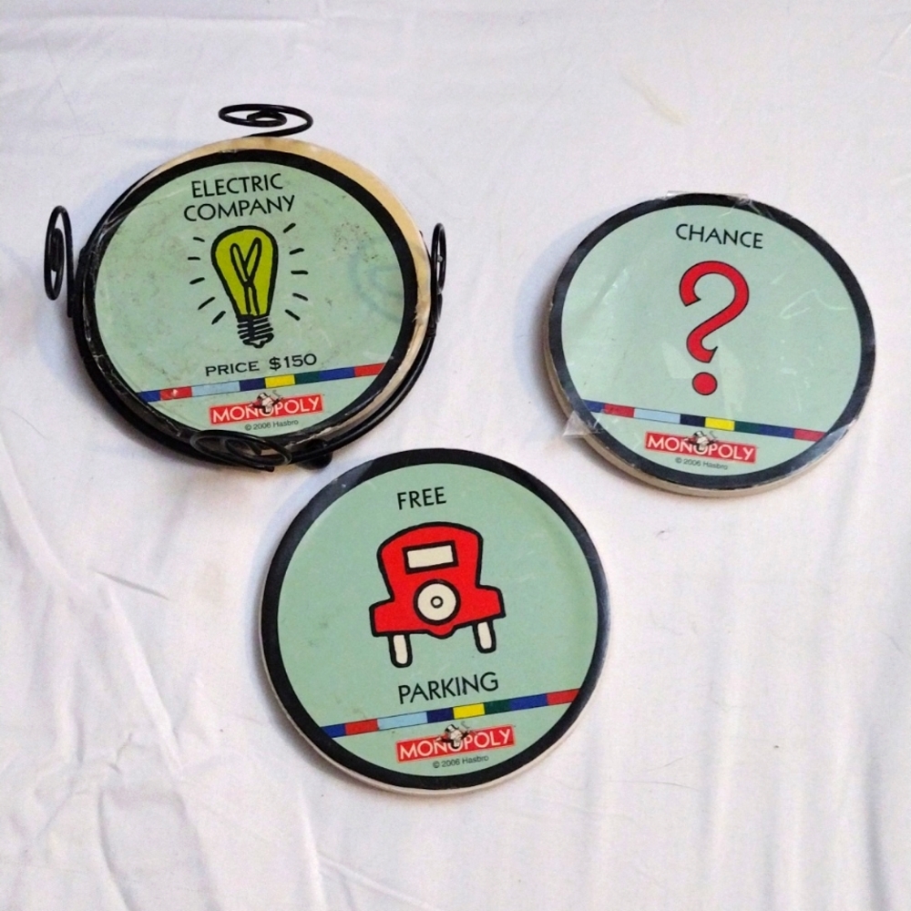 3 vintage Monopoly Cork coasters and metal holder